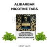 ALIBARBAR Mint Nicotine Tabs 4mg pack beside fresh mint leaves